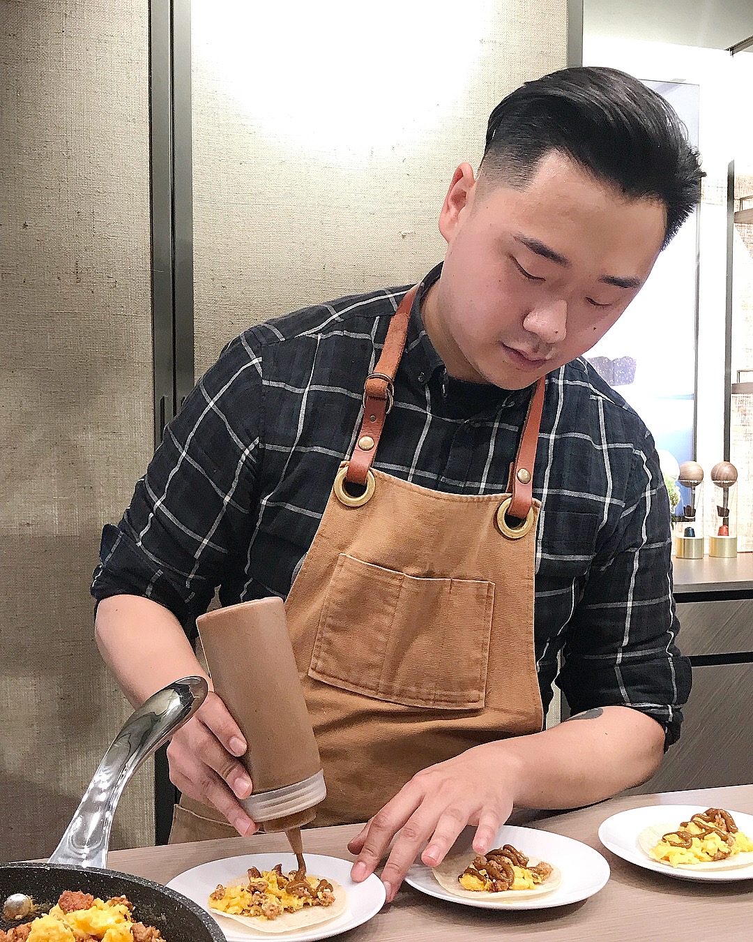 Vancouver Chef Juno Kim preparing Chorizo, Swiss Chard &amp; Egg Tacos with Nespresso Double Espresso infused Adobo Crema.