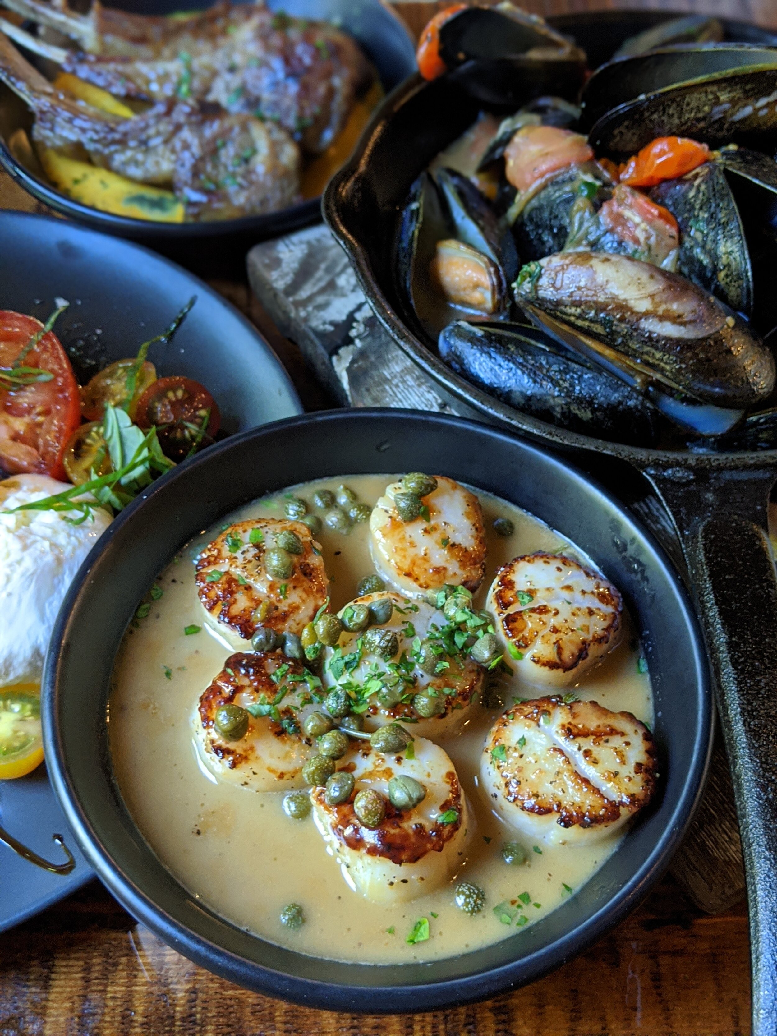 Pan seared scallops - Jumbo scallops in a white caper butter. Delicious and perfectly cooked. This was a starter item but could easily be considered as an entree, just add an order of bread.