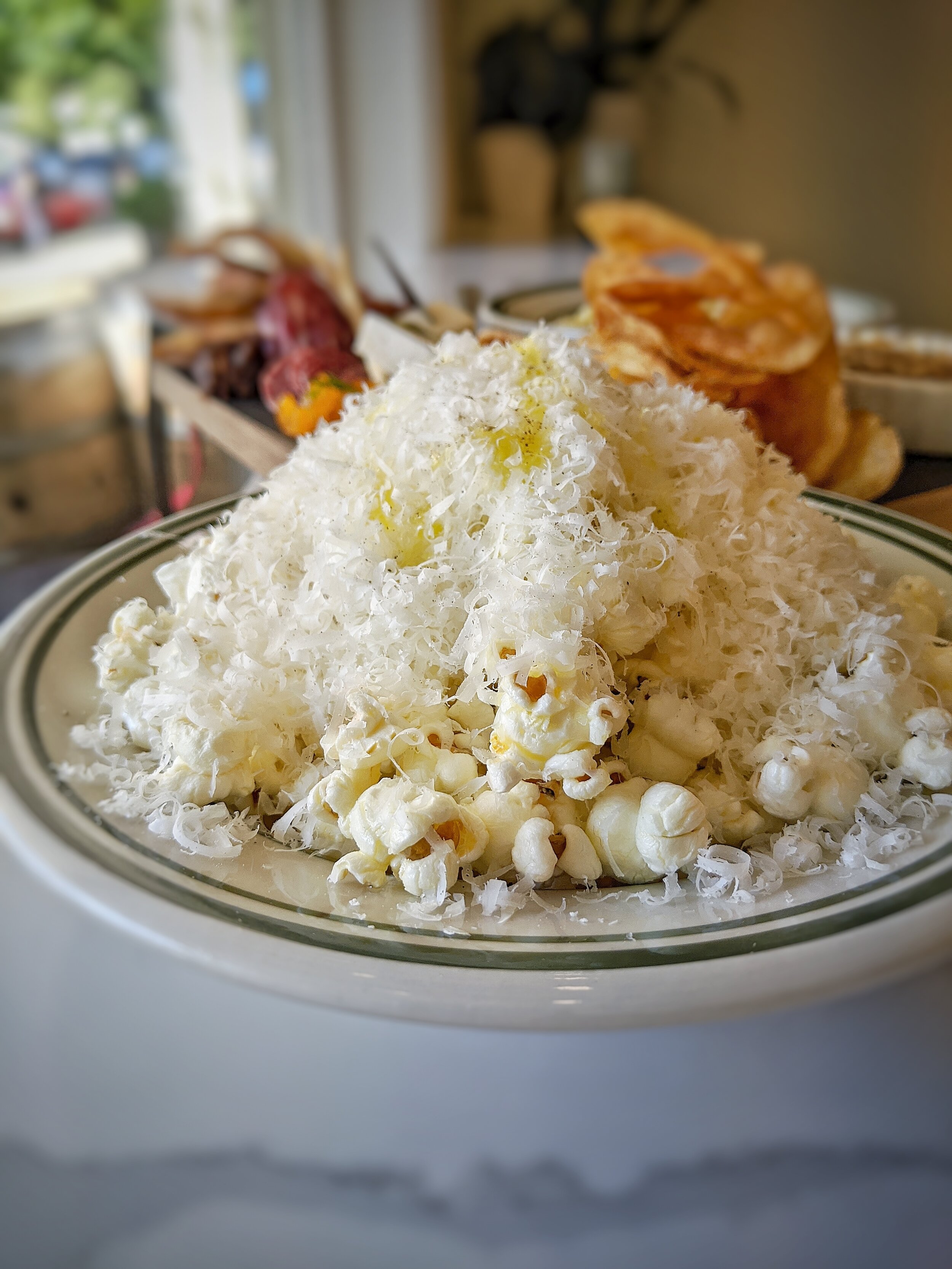Truffle Popcorn piled high with shaved Grana Padano and drizzled with truffle oil. I can’t believe this is only $6. Order this and don’t share. It’s that good!