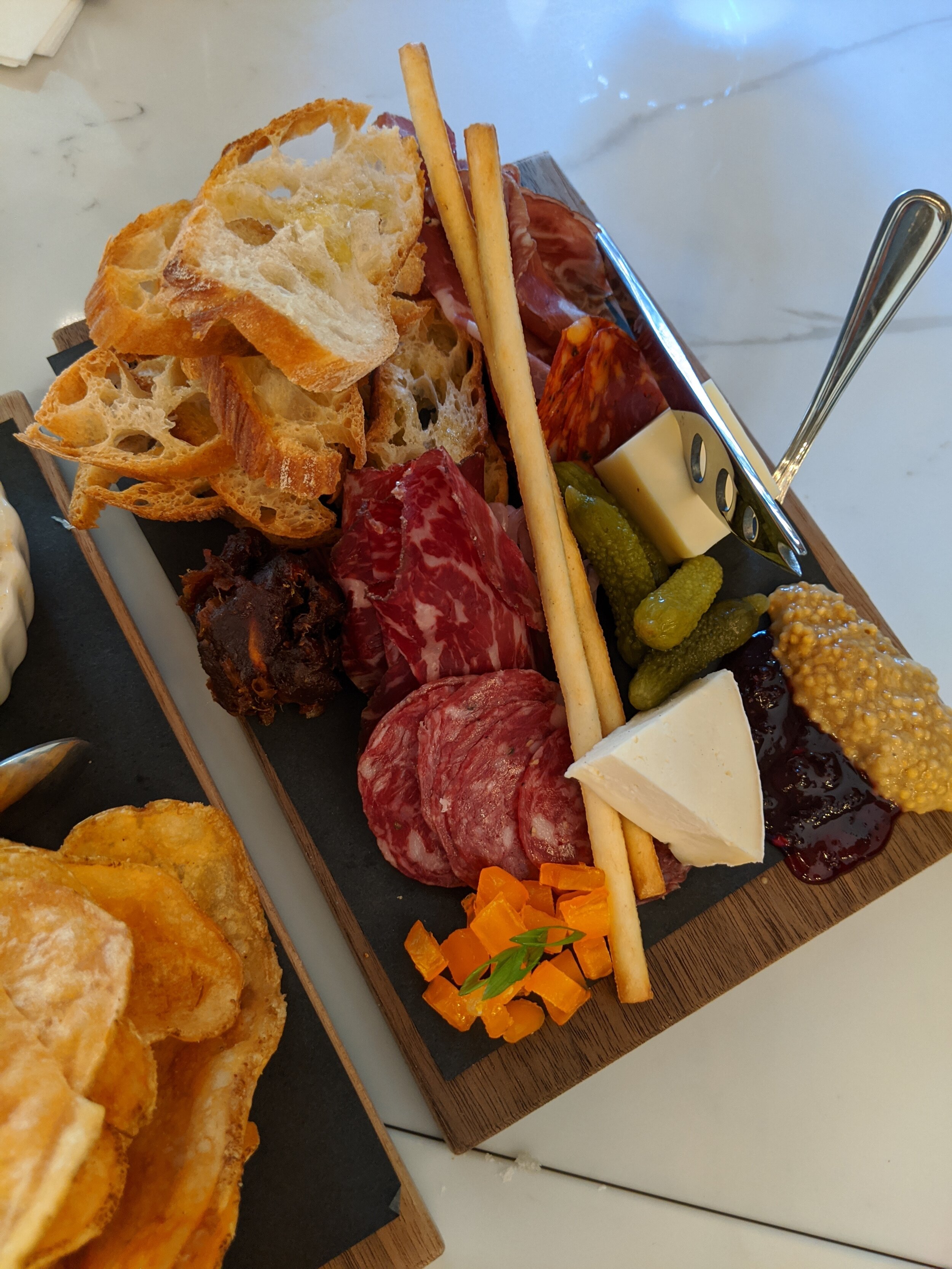 You can never go wrong with a charcuterie board in my opinion. A mix of artisan meats, imported cheese, pickles, mustard, fruit preserves, crackers and fresh bread.