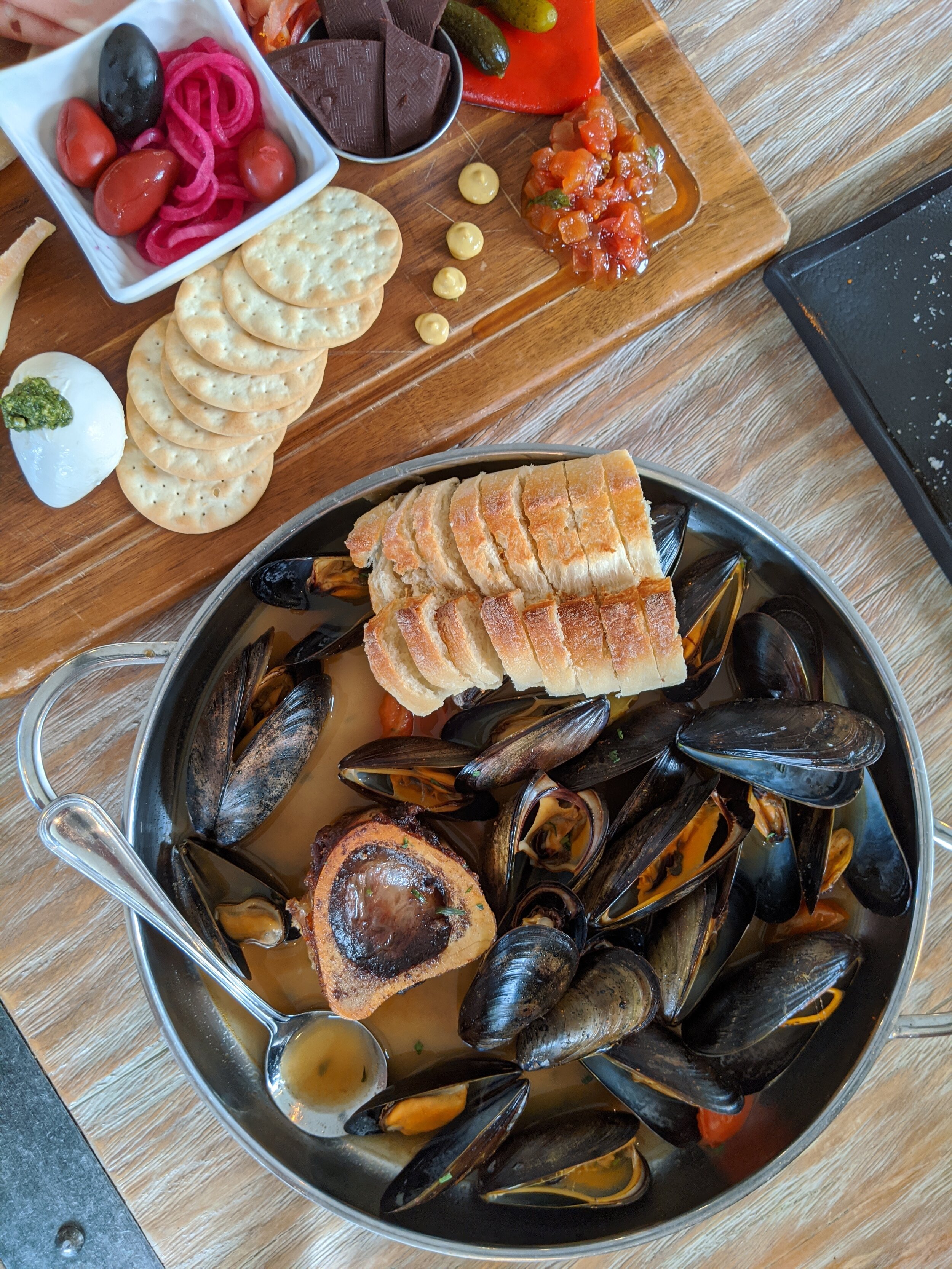 You wont find just the typical charcuterie board on the sharing menu. The mussels with bone marrow in a spicy beer broth is a nice choice.