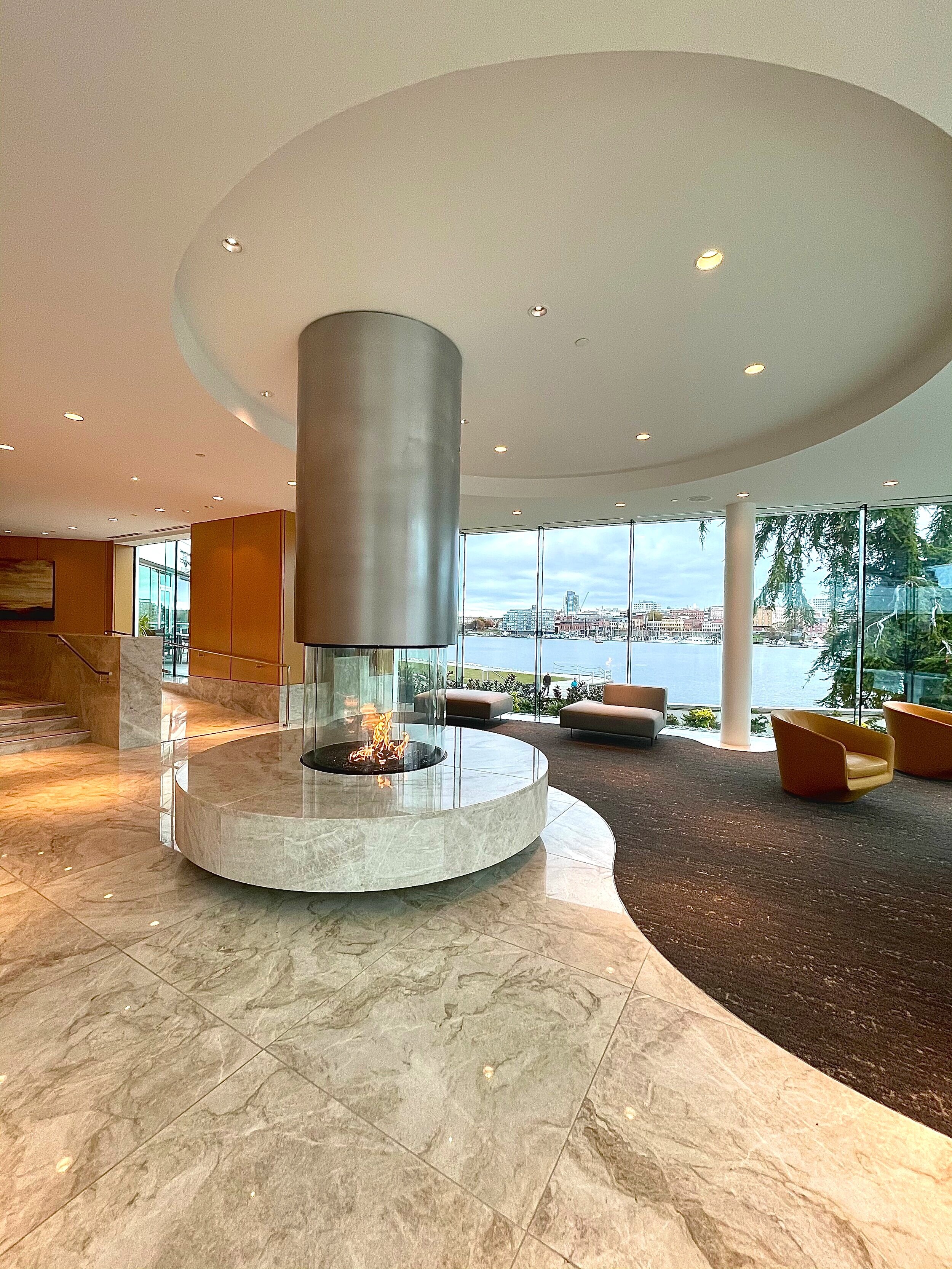 Beautifully redesigned lobby with floor to ceiling windows and contemporary fireplace.